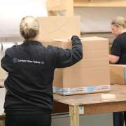 Photo showing CFT staff packing up Carbon Fibre Tubes for delivery